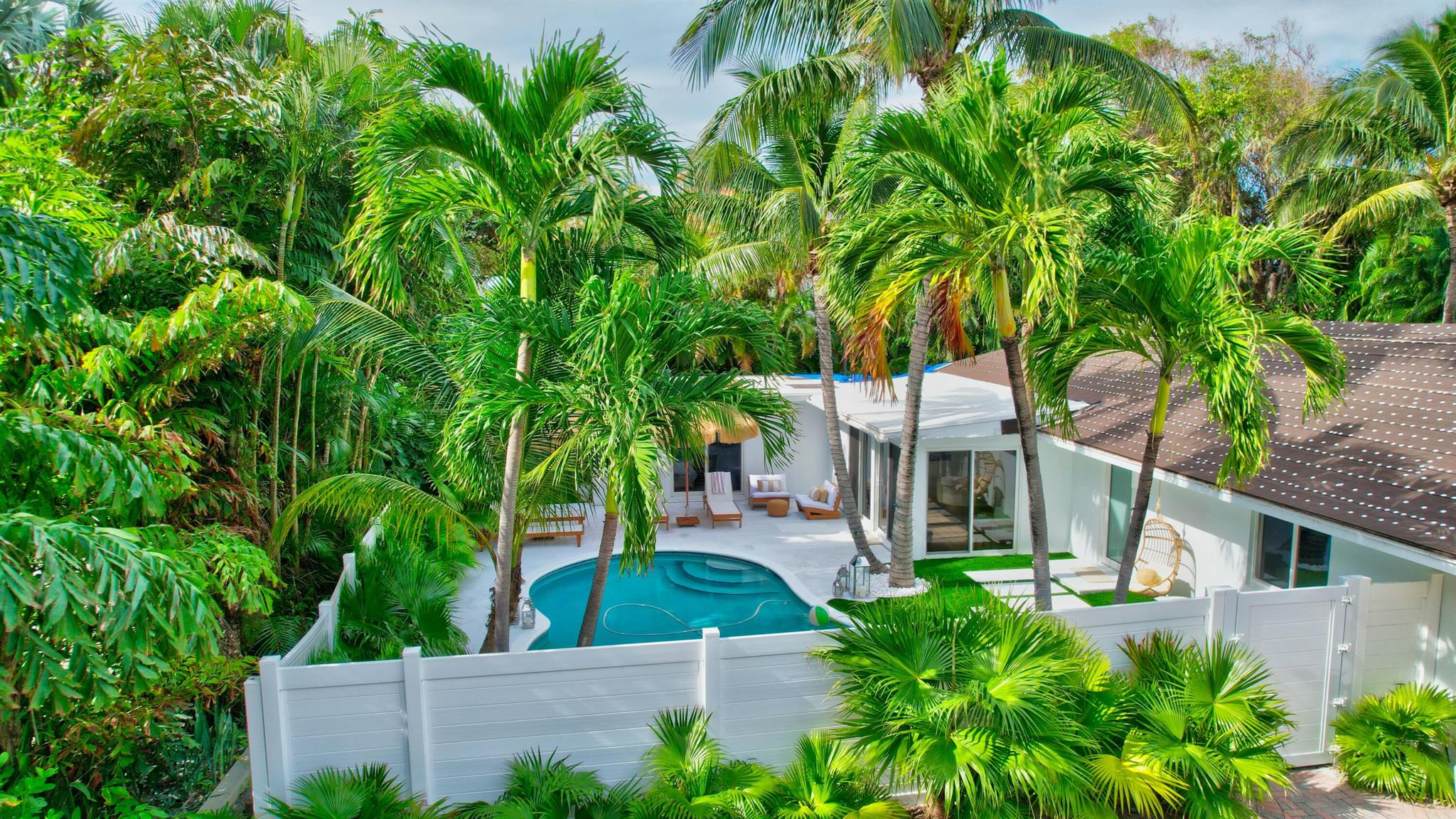 Beautiful Rental in Hypoloxo Island! Just bring your suitcase and settle into this stunning, fully remodeled 3-bedroom, 3-bathroom home situated on an oversized lot. Step outside to discover your personal oasis, complete with a sparkling pool and a mini golf coursea"perfect for relaxation and entertainment! Floor-to-ceiling windows flood the home with natural light.Enjoy a split floor plan for privacy and comfort. Open-concept living area and kitchen equipped with high-end appliances. 5-minute walk to the beach, grocery store, and top waterfront restaurants, including the renowned Eau Hotel & Spa.Palm Beach airport , Delray Beach, and West Palm Beach only a short 10-12 minute drive.