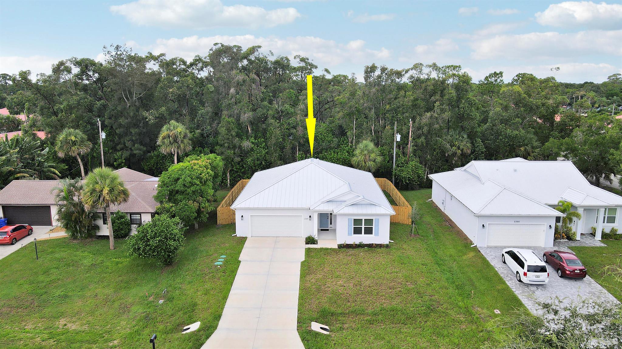 LOCATION, LOCATION, LOCATION! Brand new, never lived in 3BR/2BA/2CG home minutes to downtown Vero, beaches and the airport! Don't miss this opportunity for this gorgeous home with NO HOA! Special features include standing seam metal roof, IMPACT GLASS WINDOWS & DOORS, fenced yard, hard surface flooring t/o, designer kitchen & baths, chic light fixtures, private back yard, upgraded appliance package and more. Gorgeous kitchen with gas cooking, center island, pendant lighting, SS appliances and two tone cabinetry. Split bedroom floor plant and open great room. Retreat to the master suite with stunning spa-like ensuite and walk-in closet with custom shelving. Two additional bedroom share a hall bathroom. Fully fenced back yard is ready for your furry family members. Call today to view!