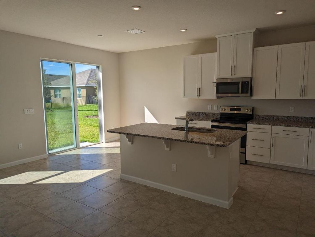 Photo of 10644 SW Vasari Way, Port Saint Lucie, FL 34987 (MLS # R10954876)