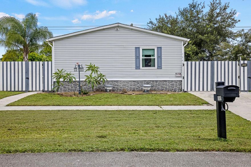 Smart and affordable, updated mint condition manufactured home in high demand Sandalfoot Boulevard Estates. YOU OWN THE LAND AND THE HOME! Built in 2005, 4 bedrooms and 2 full baths. Split bedroom floorplan. Brand new hurricane impact windows. New skirting. AC 5 years old. New water heater. Roof 2 years old. Move-in ready. Walking distance to shopping and just minutes to A-Rated schools.