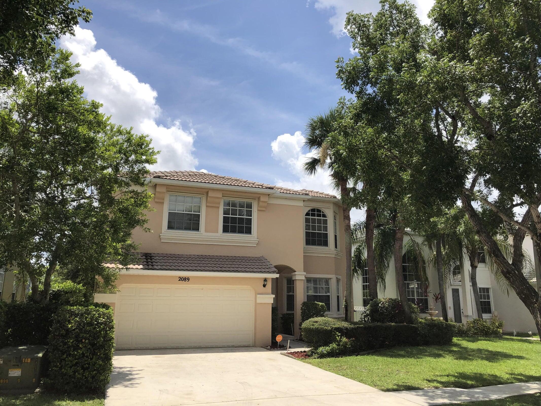 Beautiful two story 5 bedroom home with over 3038 sf overlooking M1 Canal in a gated community of Madison Green. high ceilings, NEW porcelain tiles for ground floor and new laminate wood for 2nd floor are being installed. The entire house is being repainted like new. French Doors; Huge fenced backyard and you can dock your boat in the deep canal in the backyard. This Community includes golf, resort style clubhouse, state of the art fitness center, tennis and pickleball courts, basketball courts, children's playground, kids pool with fountain, resort pool and spa. Close to A rated schools, and a short drive to to PBIA airport, downtown West Palm Beach and Wellington Green Mall. The Links at Madison Green offers daily greens fees and no equity required. Preferred Basic cable included