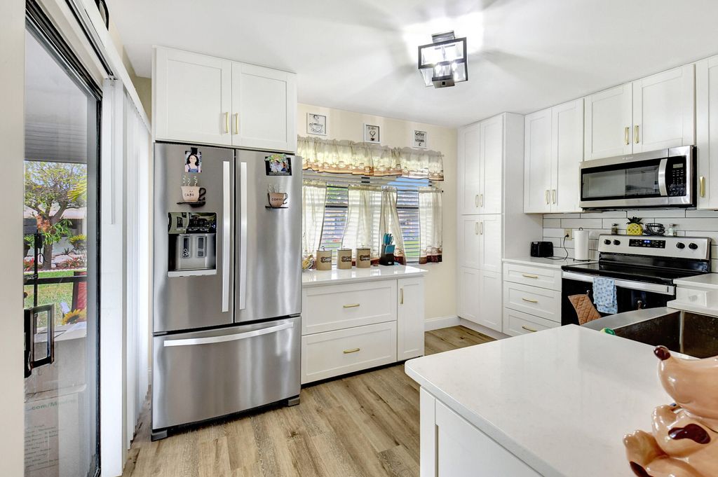 Photo of 1751 Palmland Drive, Boynton Beach, FL 33436 (MLS # R10953473)