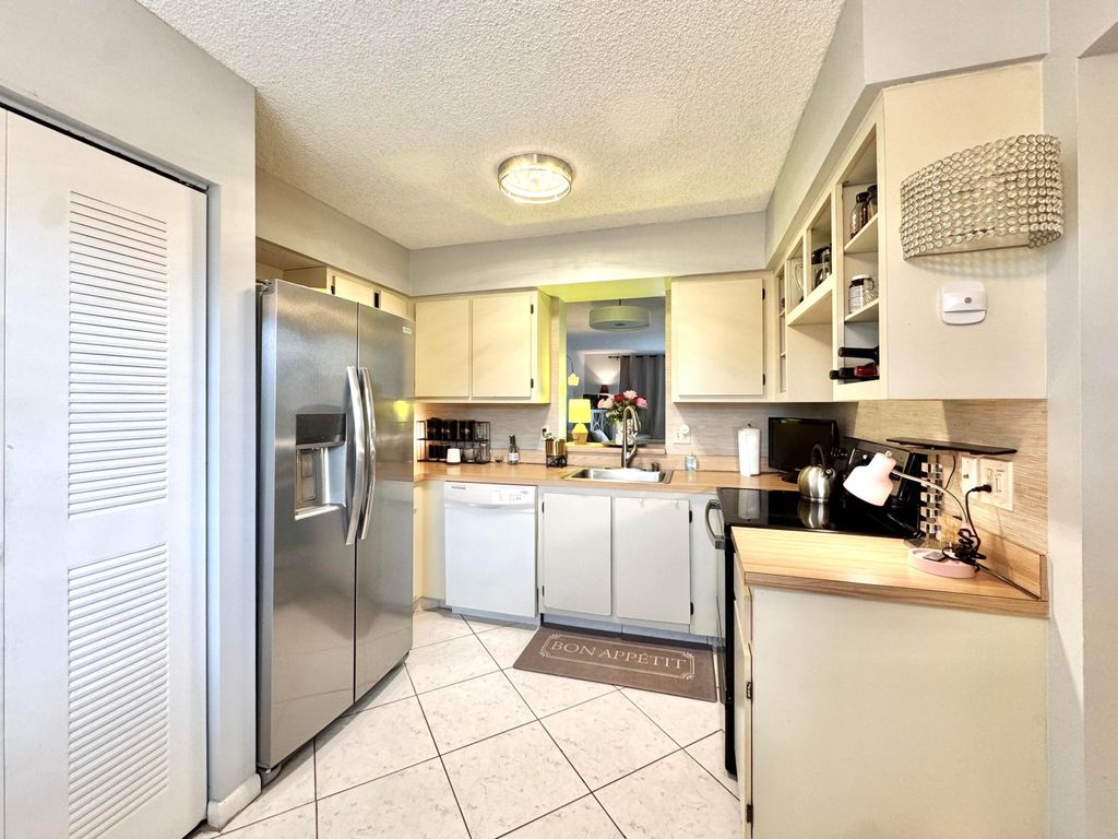 Photo of 7006 Huntington Lane, Delray Beach, FL 33446 (MLS # B26021159)