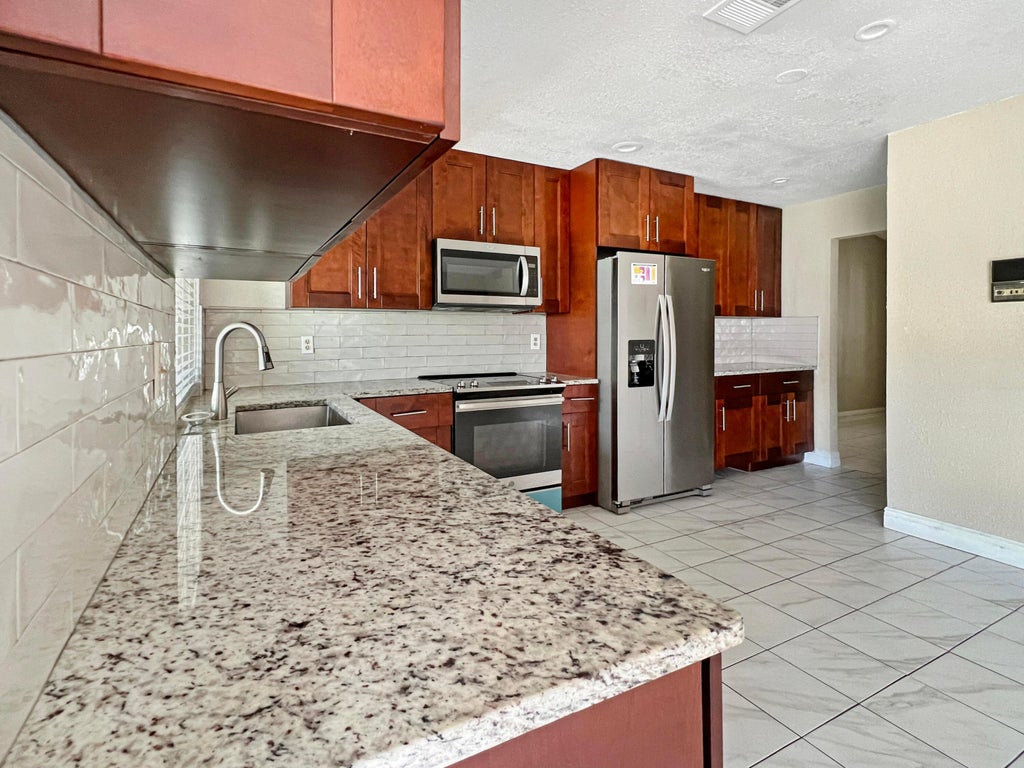 Photo of 7401 NW 48th Place, Lauderhill, FL 33319 (MLS # R11039847)