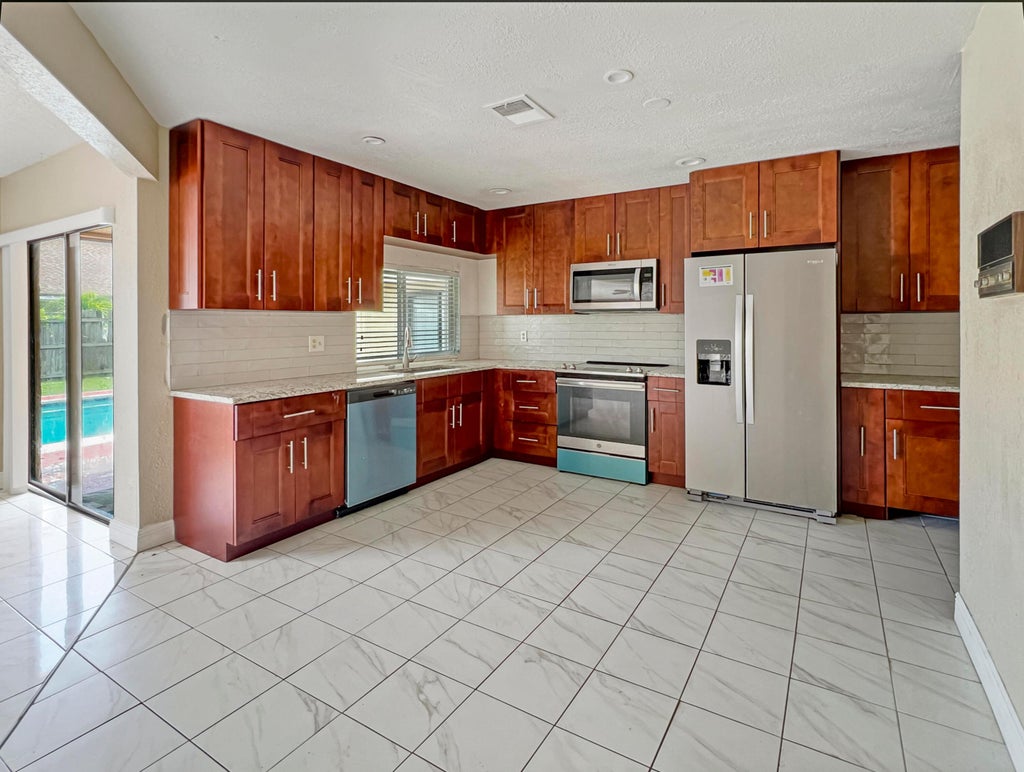 Photo of 7401 NW 48th Place, Lauderhill, FL 33319 (MLS # R11039847)