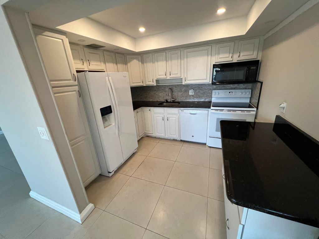 Photo of 413 Greenbrier A Cir, West Palm Beach, FL 33417 (MLS # B26007775)