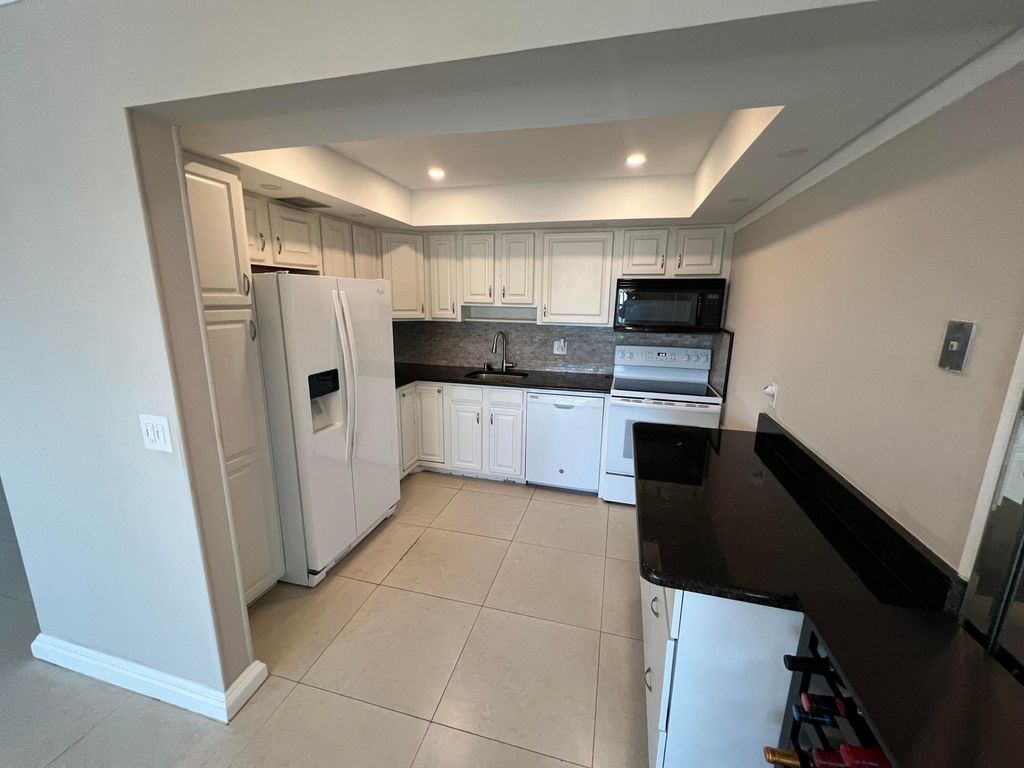 Photo of 413 Greenbrier A Cir, West Palm Beach, FL 33417 (MLS # B26007775)