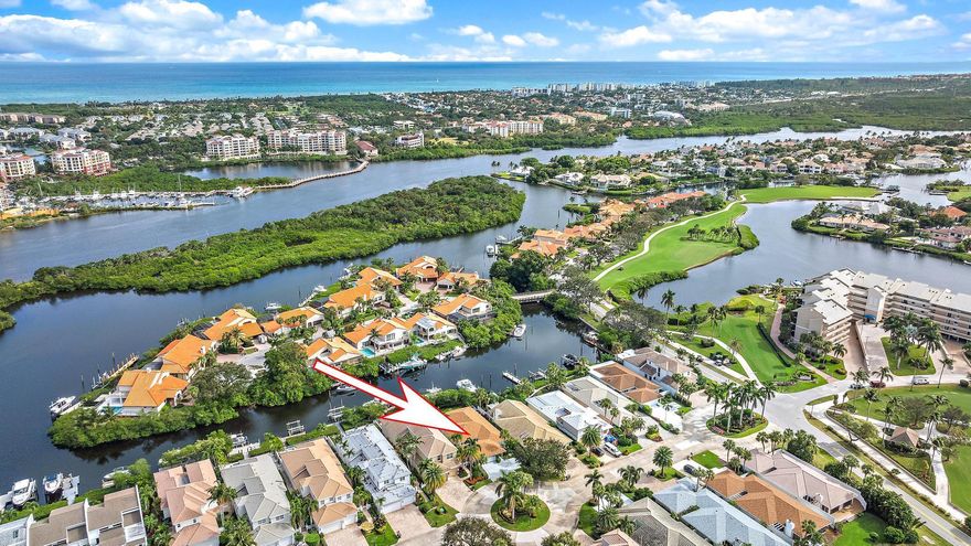 Discover this fully renovated single-family waterfront home in the prestigious Jonathan's Landing. This coastal gem features beautiful wood floors and French doors throughout. The expansive, professionally designed kitchen is complete with a large island, classic shaker cabinets, white Quartz counters, stainless steel Viking gas appliances, and custom lighting. Step down to the living area filled with natural light and a wood burning fireplace. The private backyard is fully fenced with a putting green and wrap-around deck, perfect for outdoor entertaining. Boating enthusiasts will love the private dock and 20,000 lb boat lift, offering direct ocean access with no fixed bridges and a short cruise to the inlet. A detached two-car garage connects via a covered breezeway. New A/C unit.