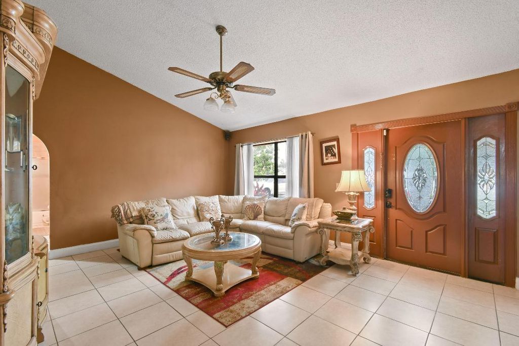Photo of 301 Canterbury Drive W, Riviera Beach, FL 33407 (MLS # R10947680)