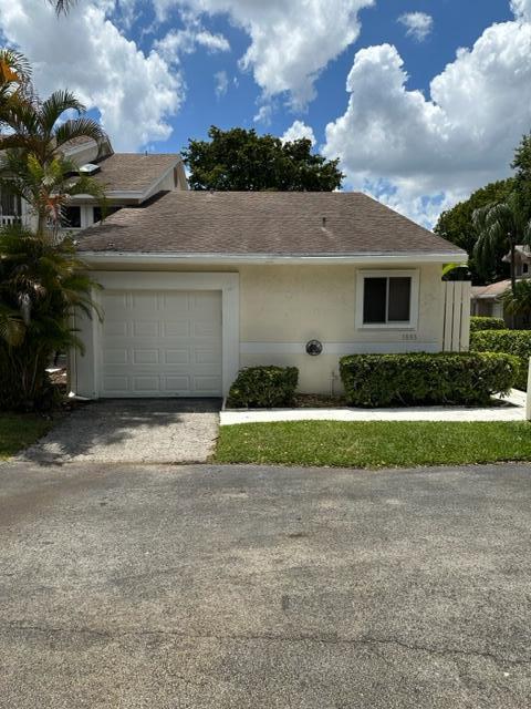 This beautiful and comfortable open concept 2/2 Villa is waiting for you! Its soaring ceilings and beautiful lake views from the large screen porch make it spacious and inviting. Flooring is tile and wood throughout, with no carpet. The 1 car garage keeps you from the elements. On a quiet cul de sac, this corner unit gets you an extra parking space at your door. Amenities include a pool, hot tub, tennis, playground and indoor racquetball with a low HOA fee in this gated community of Discovery Pointe. Only 5 miles to the beach, close to shops, restaurants and easy highway access.