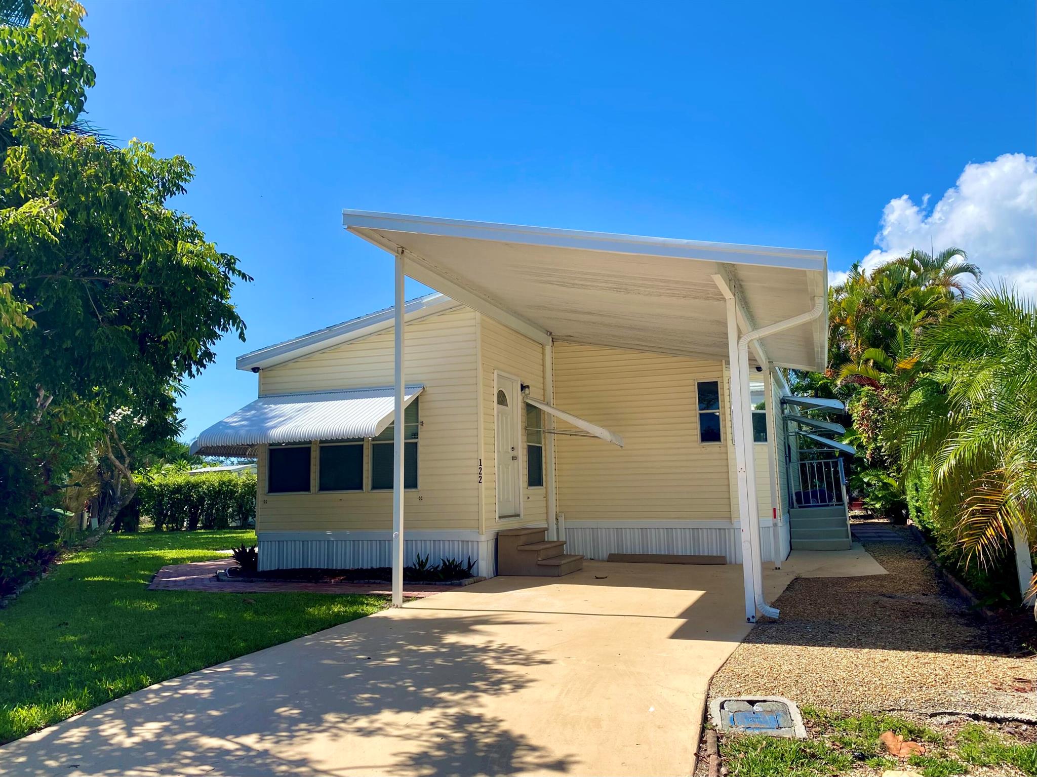Where else can you live in Jupiter ON the Water, steps away from beach, and a Dock for your own boat? One of the largest parcels in Jupiter River Park, this 2 bedroom 2 bathroom Plus Den with a large open kitchen is ready for you to make your own. Vaulted ceilings, New ON-demand tankless water heater, stainless steel appliances, natural light. Plenty of space for gardening or any other outdoor hobbies you have. Covered carport parking plus a large driveway for additional parking for your guests, large side yard and shed. Enjoy leisure living but close to shopping, restaurants, and more. Community dock available to all residents with a wait list to use specific boat docs for you boat. Dock is always available for fishing, kayaking and more.