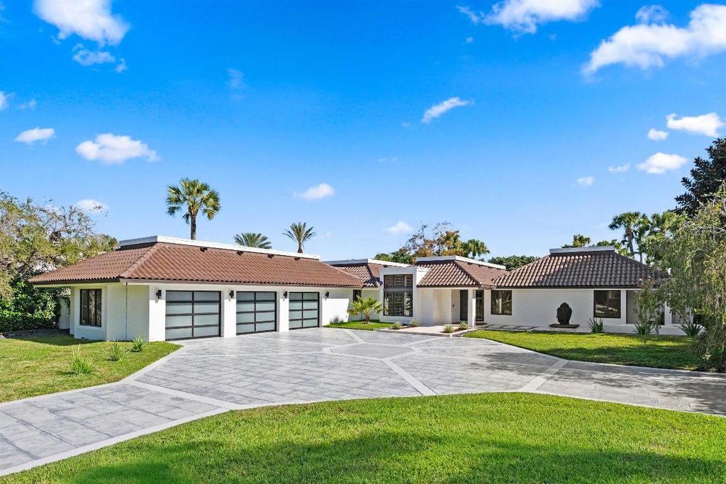 Photo of 1648 Breakers West Boulevard, West Palm Beach, FL 33411 (MLS # R11153158)