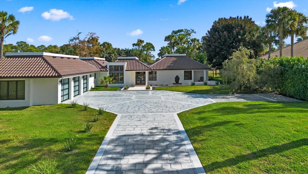 Photo of 1648 Breakers West Boulevard, West Palm Beach, FL 33411 (MLS # R11153158)