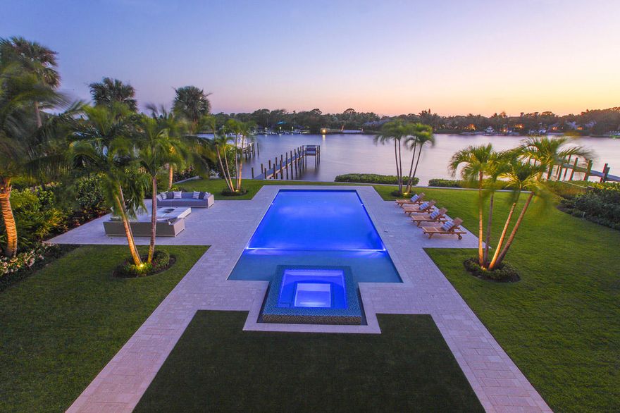 Magnificent custom built new construction custom home with the best of everything. Wide river views of the Loxahatchee river, Built with the finest of craftsmanship and materials. This home features 5 Bedrooms, game/media room, gourmet kitchen with marble counter tops, High end appliances, 2 laundry rooms, Hardwood and marble flooring, elevator, impact glass, large master suite, The home opens up to reveal the resort style pool and patio, summer kitchen with covered patio combined with the cool river breeze makes living a paradise! owner financing under certain circumstances