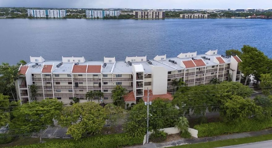 Some photos have been virtually staged. Bright, updated 2/2 condo with stunning views of a 168-acre lake in secure, 24/7 guard-gated Lake Emerald. Modern kitchen features white shaker cabinets, quartz countertops, and stainless steel appliances. New vinyl flooring, fresh paint, and refreshed bathrooms with new vanities and lighting throughout. Major upgrades completed, including 40-year recertification, new 2024 roof, concrete/stucco restoration, and waterproofed balconies. Remaining assessment paid by seller at closing! Enjoy resort-style amenities: 3 pools, jacuzzis, gym, tennis & basketball courts, lakeside BBQ clubhouse, kayaking, and paddleboarding. Minutes to Fort Lauderdale attractions. Turn-key, worry-free living! Owner financing available with flexible terms - no bank needed!