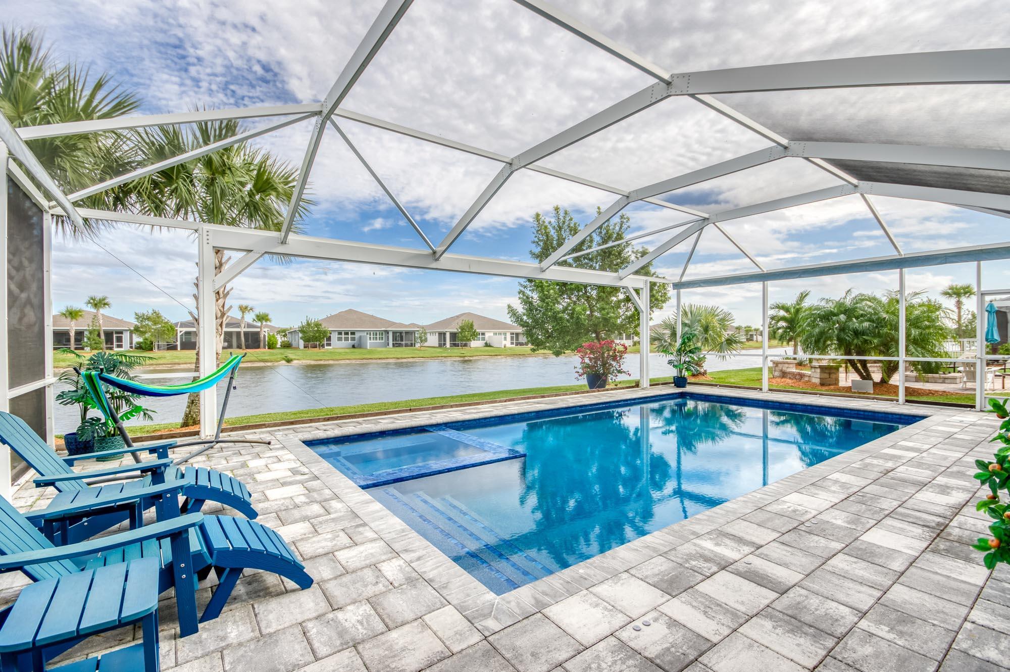 Move right into this stunning 3BD/2BA+flex room home in the sought-after 55+ community of Del Webb. This home offers luxury living with over 200k in upgrades. The open-concept layout features a gourmet kitchen with quartz countertops, high-end appliances, and a gas range. Custom shiplap walls, designer lighting, built in closets, motorized shades on sliding doors, solar panels for low energy bills are just some of the upgrades that elevate this home well beyond builder-grade. Step outside to your private heated saltwater pool and spa enclosed in a panoramic screened lanai overlooking a tranquil lake. Residents in Del Webb enjoy two resort-style pools and clubhouses, fitness center, pickleball and tennis courts, walking trails, putting green, dog park and an active calendar of clubs and