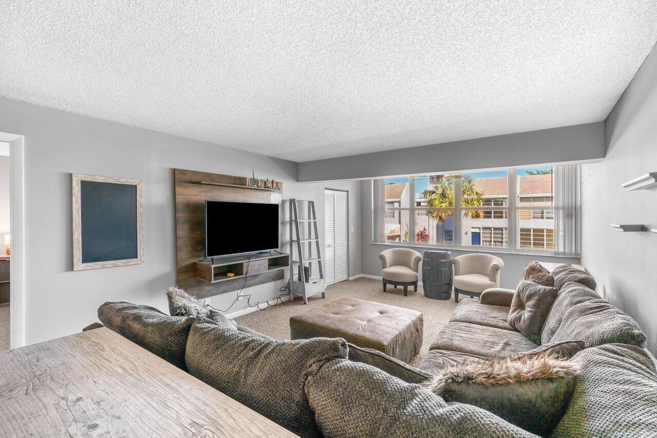 Introducing a stunning 2-bedroom, 2-bathroom fully furnished condo available for rent in Delray Beach, just off I-95! This beautifully maintained unit features modern kitchen and bathroom upgrades and offers a relaxing pool in the backyard. Enjoy the convenience of being close to Atlantic Avenue, pristine beaches, Boca Raton, an array of shops, restaurants, and major highways. Situated in a highly desirable location, this condo is perfect for annual rental and is within an excellent school district with both the middle and high schools rated A. Don't miss out on this incredible opportunity - it won't last long!