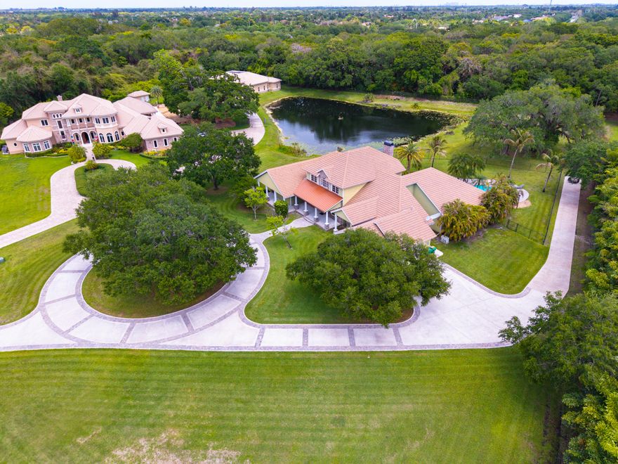 Welcome to a private gated estate situated on approximately 2.51 acres in one of Davie's most sought-after luxury acreage communities. This impressive 5-bedroom, 5-bathroom residence offers over 5000 SF of living space and is ideally positioned with preserve views and no rear neighbors, creating an exceptional sense of privacy and tranquility. Designed for both entertaining and everyday living, the home features expansive living spaces, spacious bedroom suites, and a layout that embraces the surrounding estate setting. The oversized homesite offers endless possibilities for recreation, equestrian use, guest accommodations, additional structures, or future enhancements. Surrounded by premier estates and conveniently located near top-rated schools, equestrian facilities.