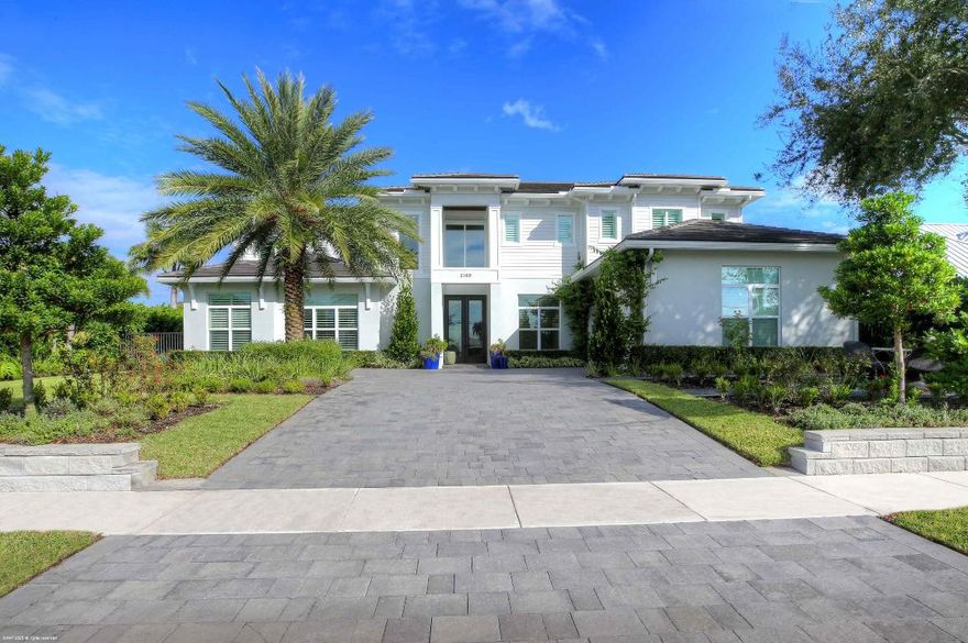 Built new in 2020, this fabulous Palm Beach Gardens Modern Island Smart Home boasts 5 bedrooms and 5.5 baths and over 7900 of total sq ft! 
The open floor plan includes a Gourmet Chef's kitchen with 2 large islands and a huge pantry! A wall of French Doors all open to a massive covered and screened patio with a summer kitchen and a beautiful heated infinity pool/spa and 100' of waterfront including a boat dock!
The primary suite is stunning with a massive bath and huge closets. All the bedrooms upstairs access a large open balcony to capture the water views or to watch a sunrise or sunset.  The home has high ceilings with recessed lighting, Plantation Shutters, an elevator and a whole house generator.  
It's a boaters paradise yet just minutes away from everything.