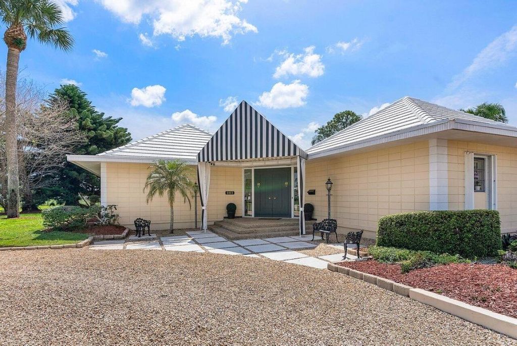 Photo of 261 N Country Club Drive, Atlantis, FL 33462 (MLS # R10970299)