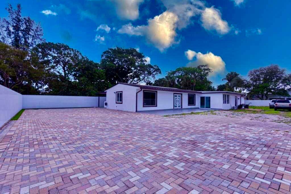 Photo of 696 Arlington Drive, West Palm Beach, FL 33415 (MLS # B26051344)