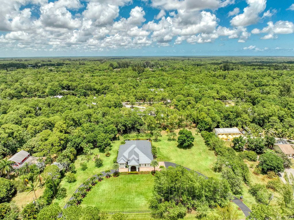 Photo of 9853 Whippoorwill Trail, Jupiter, FL 33478 (MLS # R10985548)