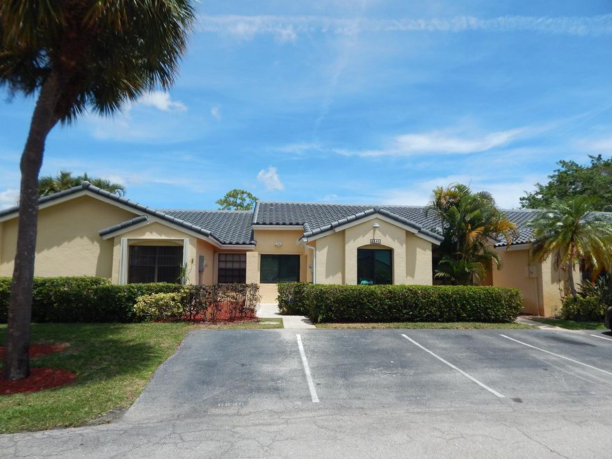 Wake up to tranquil lake views in this fully renovated, whisper-quiet villa designed for effortless South Florida living. Back on market due to buyer financing default just days before closing--no inspection or appraisal issues. Their loss is your opportunity.  Vaulted ceilings and impact windows create a bright, open feel throughout. Updates include a brand new roof, upgraded electrical panel, designer kitchen and baths, plus ceramic tile and luxury vinyl flooring--making this home truly move-in ready.  Enjoy seamless indoor-outdoor living from the screened porch to a private patio with retractable awning overlooking serene water views. Located in an A-rated school district.  HOA offers low-maintenance living with cable, internet, exterior insurance, lanndscaping & Pool.
