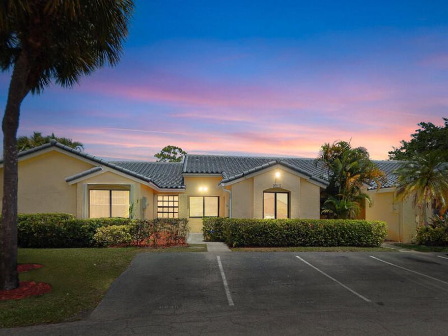 Wake up to tranquil lake views in this fully renovated, whisper-quiet villa designed for effortless South Florida living. Back on market due to buyer financing default just days before closing-- Property appraised and successfully moved through inspections.  Their loss is your opportunity.  Vaulted ceilings & impact windows create a bright, open feel. Updates include a brand new roof, upgraded electrical panel, designer kitchen and baths, plus ceramic tile and luxury vinyl flooring--making this home truly move-in ready.  Enjoy seamless indoor-outdoor living from the screened porch to a private patio with retractable awning overlooking serene water views. Located in an A-rated school district.  HOA offers low-maintenance living with cable, internet, exterior insurance, lanndscaping & Pool.