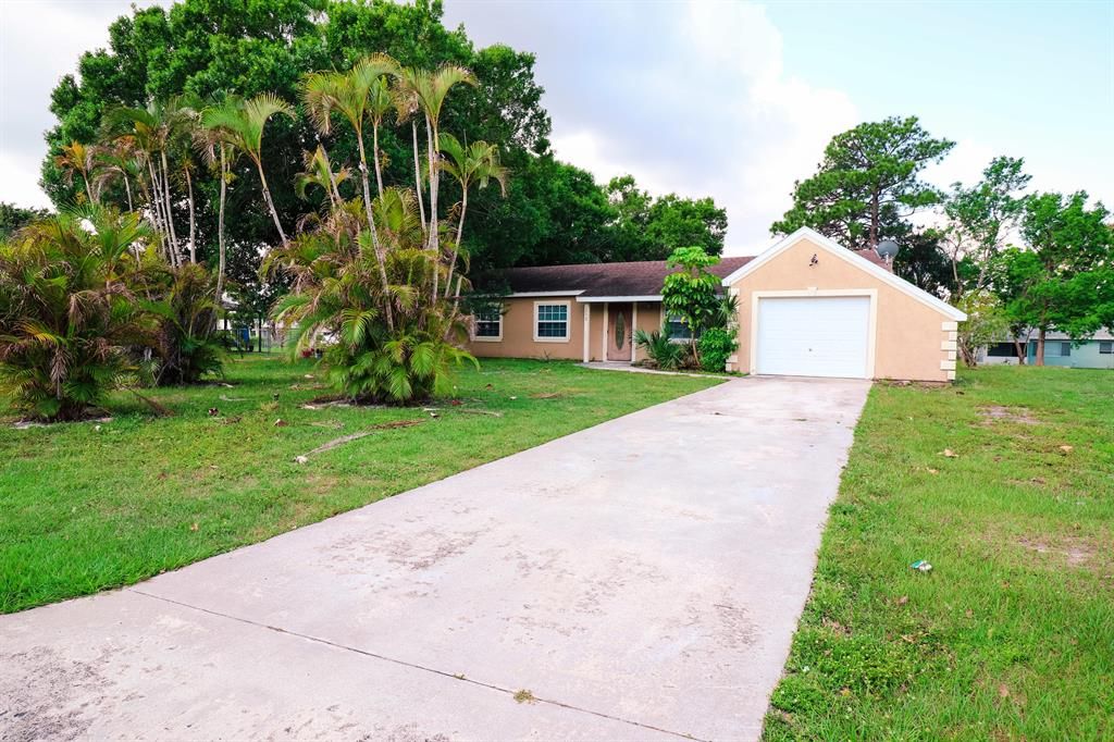 Photo of 2092 SE Triumph Road, Port Saint Lucie, FL 34952 (MLS # R10712191)