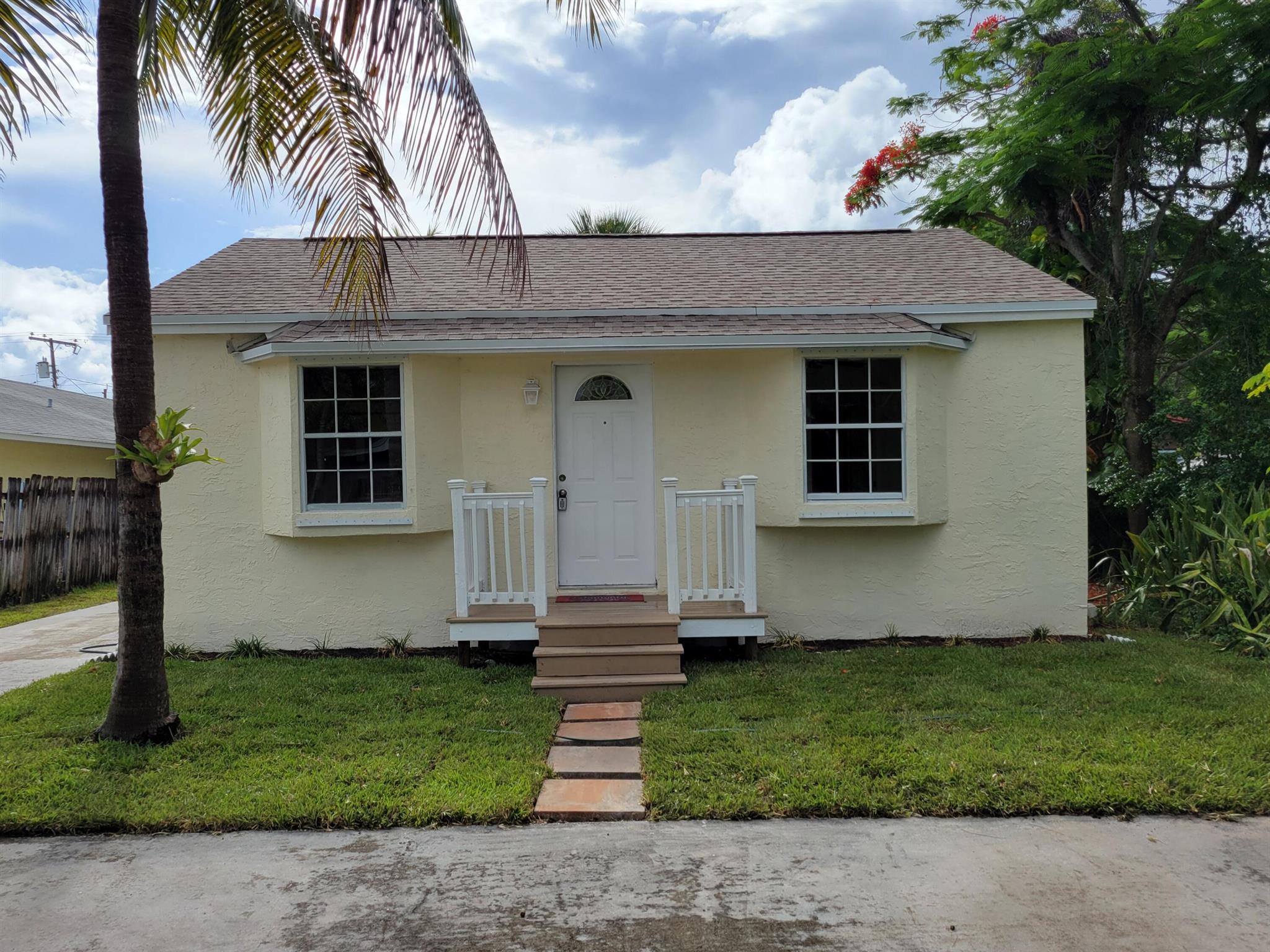 East Lantana, close to Old Key Lime House, beach, shopping. Lantana is an upcoming area quickly developing with many new businesses and restaurants. No HOA or restrictions. Both houses have new interior and exterior paint and hurricane shutters. HOUSE is 1/1 with Den or 2/1 (850 sq ft) and COTTAGE is 1/1 (425 sq ft). HOUSE: New roof, AC, ductwork, hot water heater, dishwasher, ceiling fans and lights, exterior doors, flooring and original restored hardwood floors. Unique property with deep lot, plenty of room for expanding existing houses or add a pool, park RV or boat. Bike to Old key Lime house and beach. Plenty of restaurants, WAWA, shopping and entertainment nearby. Lots Of Land Value. Move-In Ready! Walking distance to Intracoastal & Ocean. Nearby boat ramps.
