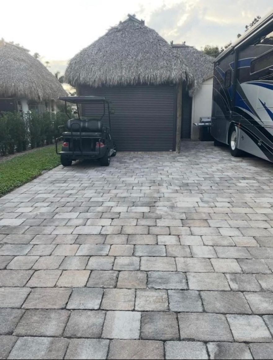 Welcome to your tropical RV oasis! Rare find combining comfort, style, and resort-style living! Enjoy the impressive 30’ x 15’ tiki hut with electric shutters and mosquito screens, installed 2023, ideal for relaxing or entertaining. Custom shed includes: Murphy bed, full bathroom w shower. Extra storage for ultimate convenience. Lot comes fully furnished with a living room set, bistro table,high-end American teak dining table with 6 chairs (invoice available). Golf cart with brand-new batteries is also included! Room to expand with options to add a rear extension or balcony for even more outdoor living space. Nestled amid lush tropical landscaping in a friendly community, this property is turnkey and ready for your RV lifestyle, whether as a seasonal escape or your full-time paradise!