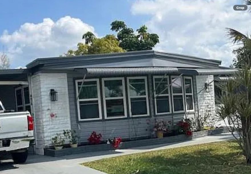 55 plus community This mobile home sits on the lake with a nice water view the community is well kept and the home has been maintained well. Two bedrooms two bath, Also den and Florida room, and shed. Also amenities with pool and boat RV storage and clubhouse for activities.