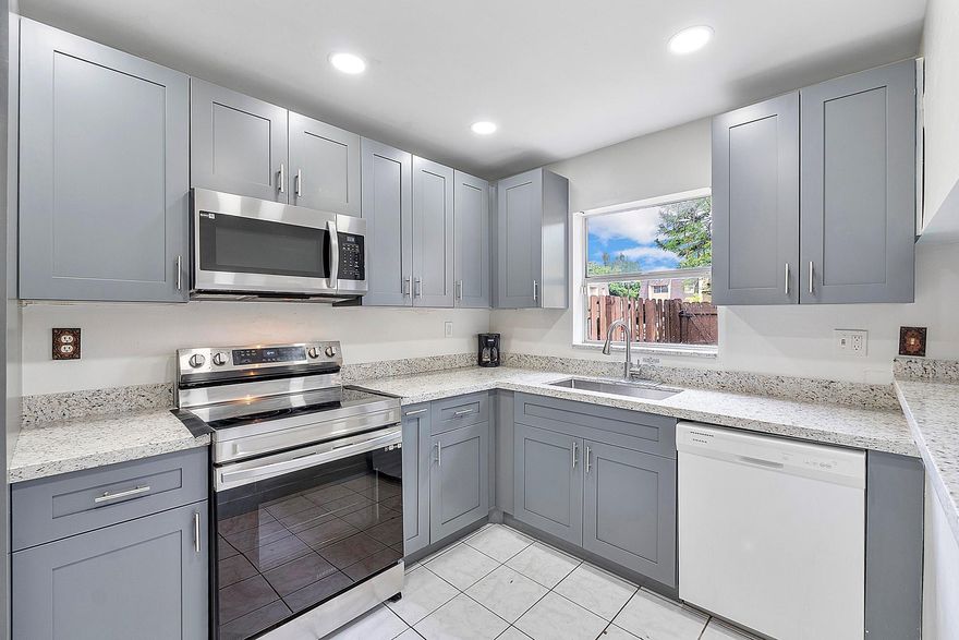 Beautifully Updated Corner Townhome in Blueberry Hills! Discover comfort & style in this spacious 3-bedroom, 2.5-bath townhouse perfectly tucked away in the quiet Blueberry Hills community of Lauderhill. This bright corner unit features an upgraded kitchen with modern finishes & stainless-steel appliances, ready for all your cooking adventures. Step outside to a private fenced patio area, great for unwinding after a long day or hosting weekend gatherings. Enjoy peaceful surroundings with this home’s prime location at the rear of the neighborhood. Two assigned parking spots provide everyday convenience, while community amenities like the sparkling pool add to the appeal. This move-in ready home offers the perfect blend of privacy, comfort, and community living.