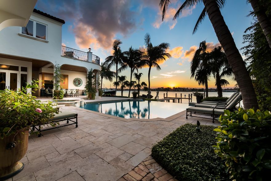 Located in prestigious Point Manalapan, this waterfront paradise provides amazing views of the Intracoastal. This stunningly designed home built in 2008 boasts six bedrooms and seven full bathrooms and one half bathroom. Enter the home through custom made French doors into a dramatic two story foyer looking into living room with fireplace and water views. To the left of the entry you will find a private formal dining room with a temperature controlled wine room. The open concept chef's custom kitchen and family room make entertaining easy. Take the elevator upstairs to your enormous master suite with his and her bathrooms, large custom closets, sitting area and large balcony peering over the pool and Intracoastal. An office connects to the master with an additional separate entrance.