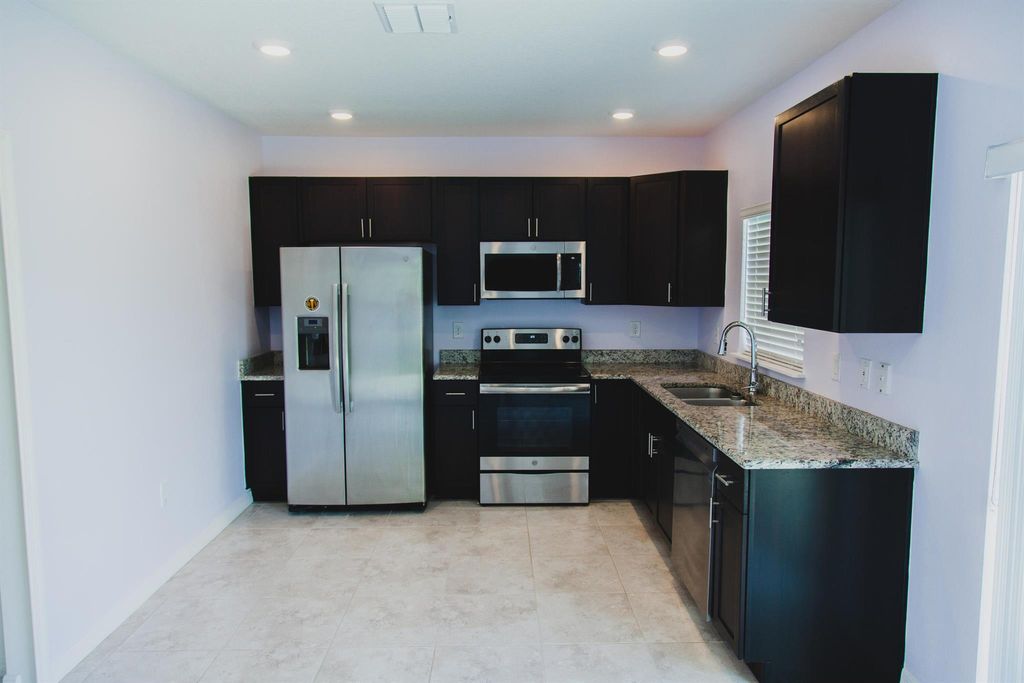 Photo of 4025 SW Kallen Street, Port Saint Lucie, FL 34953 (MLS # R10929175)