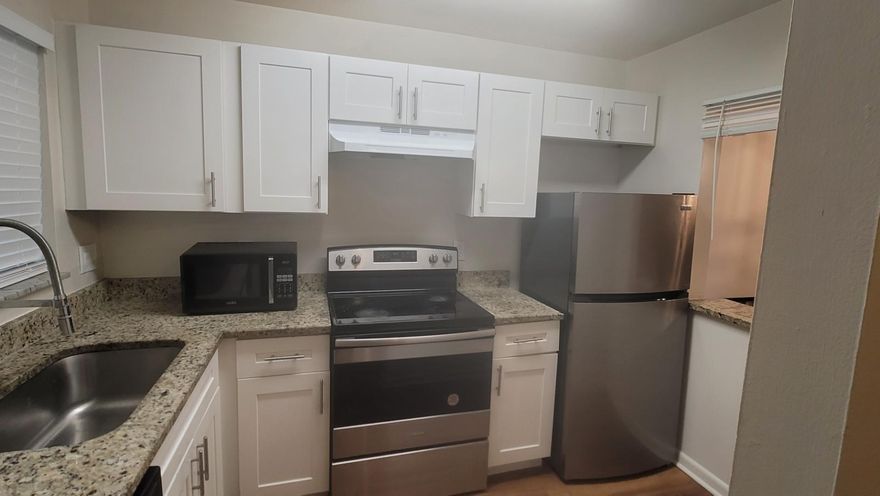 This Freshly Painted spacious End Unit  2/2 condo features Newly remodeled bathrooms, Glass Shower Doors new Vanities & Fixtures ,Remodeled Kitchen Stainless Steel appliances,  New 2022 AC Unit with both bedrooms having  walk in closets  . Home also includes accordion shutters on all windows. It is perfectly located in a great area, walking distance from restaurants, major shops and just 10 minutes away from City Place. The location provides easy access to major highways, and you can get whatever you need within walking distance. This condominium is perfect for those who value convenience. Can also be a great investment opportunity, seasonal or primary residence !