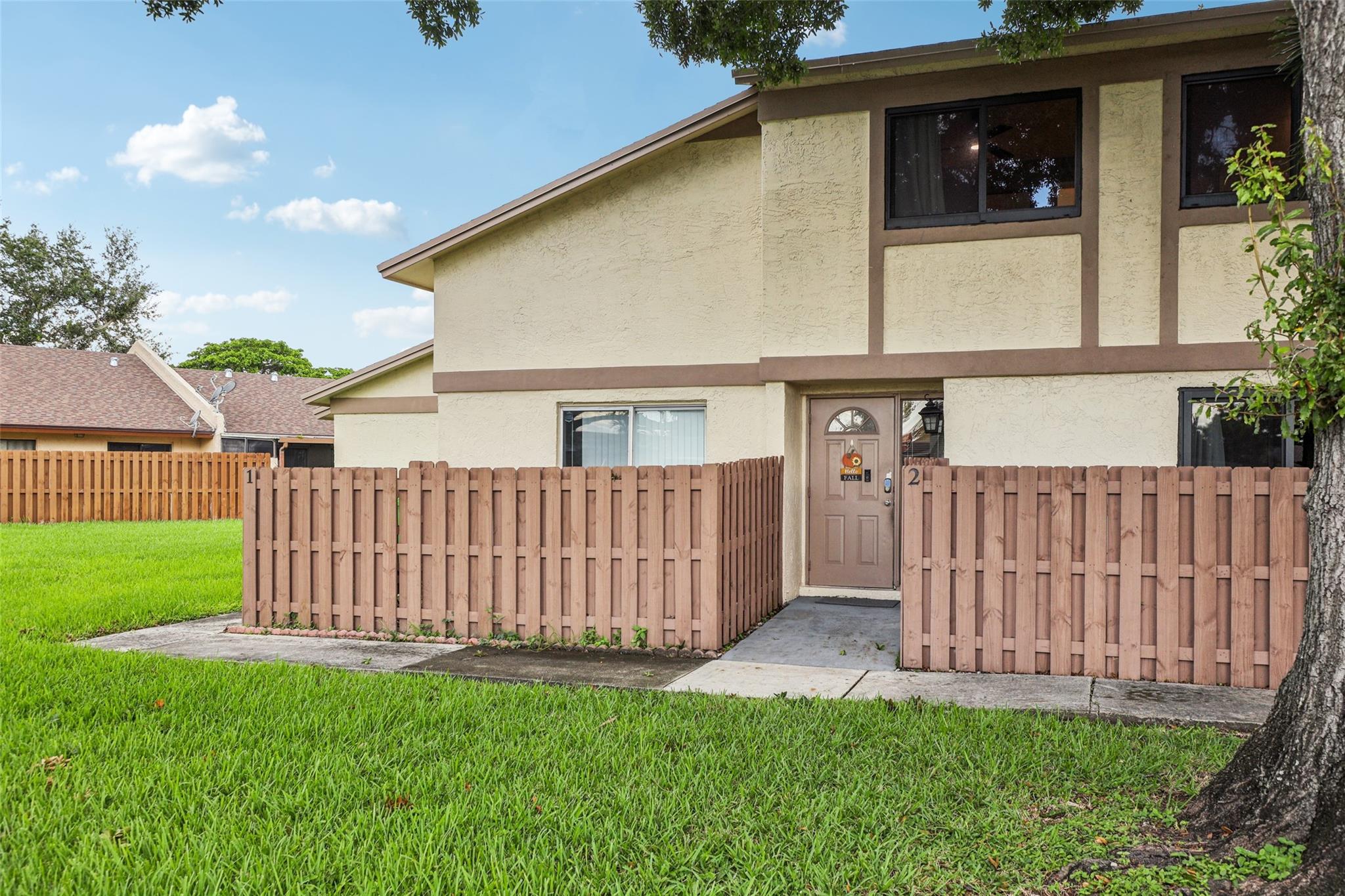 This spacious 3-bedroom, 2.5-bath townhouse offers more square footage than most currently available in the community, giving you room to live comfortably. The roof and the fence were replaced in 2023. Air conditioning was replaced in the summer of 2022, and the home features impact windows for added safety, noise reduction, and energy efficiency. Enjoy a private backyard for quiet mornings or evening relaxation, while the HOA handles water, trash, and all exterior maintenance — including landscaping, painting, and structural care. Located in a calm, well-managed neighborhood, this home is spotless, move-in ready, and perfect for buyers seeking value, space, security, and ease in one beautifully maintained package.