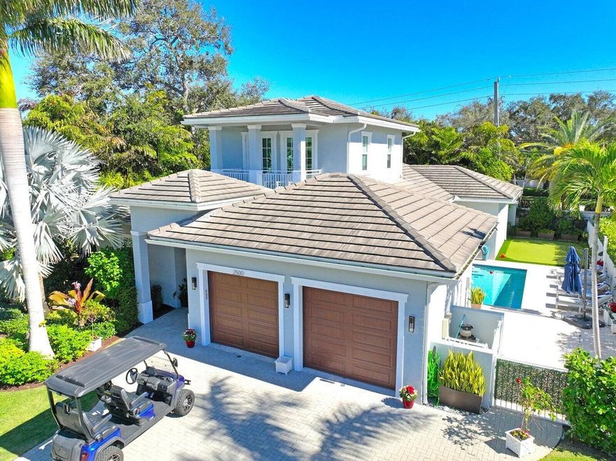 Better than new! This 2020 custom-built modern home tells a story of elegance, ease, and impeccable detail. Tucked inside an exclusive 12-home gated enclave in the golf-cart-friendly Village of North Palm Beach - one of Florida's safest and most desirable communities - every moment here feels like a retreat. The open floorplan offers 4 bedrooms 3.5 baths on the main level + an upstairs suite w/ bedroom and office / playroom, or ideal au pair space, complete with full bath and balcony. Enjoy soaring 12-15' ceilings, white oak floors, and a chef's Thermodor kitchen. Outside, relax by the salt-system pool, travertine terrace, putting green, and summer kitchen. Tesla charger, volume-ceiling garage, and minutes to Benjamin School, beaches, shopping, dining, Palm Beach Island and PBI Airport