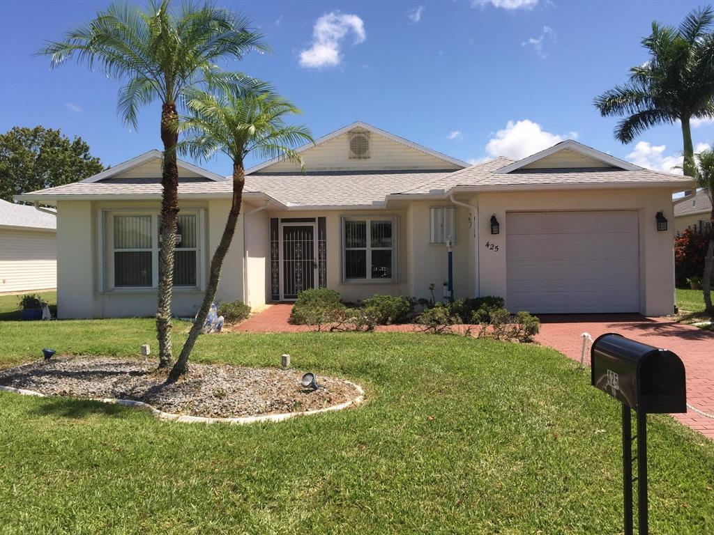 LAKE VIEW 2/2/1 CBS home in sought after 55+ Palm Grove subdivision. This beautiful home features volume ceilings, tile throughout, Stainless Steel appliances, accordion hurricane shutters, A/C from 2010, an electric tankless water heater and much more. The furniture is included if the buyer wants it. Only one cat and/or dog 35 lbs max. is allowed in Palm Grove. An HOA orientation is required prior to closing, ($50 application fee). This home is close to all amenities. Measurements are approximate.