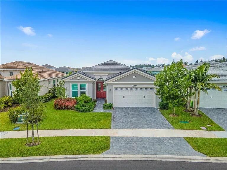 Weslake Persimmon model. 3 bedrooms, 3 full bathrooms on an oversized, pie shaped lot with a beautiful lake view. Upgraded espresso kitchen cabinets, quartz countertops, upgraded tile throughout the home. Crown molding throughout, hi-hats in the family room. Beautiful wood trim work in foyer/entry. Formal living room and dining room. Double doors, covered lanai, large master bedroom, huge bathroom and closet, frameless shower enclosure, upgraded cabinets and counters in all bathrooms. 2nd bedroom has an ensuite bath. Samsung front load washer and dryer, upgraded refrigerator with InstaView door-in-door, storage rack in garage. Westlake's resort style amenities include a lagoon pool with a 3 story slide, splash pad, cabanas, lawn space for parties and outdoor concert.