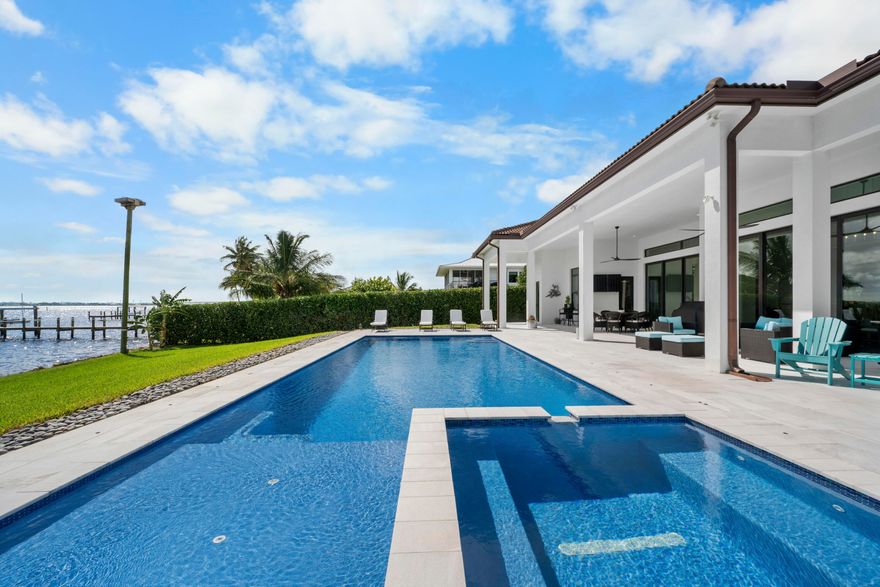 FIRST TIME ON MARKET! Premier waterfront location built in 2020. Modern-Mediterranean home close to downtown Jensen Beach and Stuart. Spectacular southern exposure and wide-water view. Direct ocean access minutes from the St. Lucie Inlet. No low bridges - a boater's dream. High coffered ceilings, four spacious bedrooms plus a den, four full baths, and a cabana bath designed for everyday comfort and effortless entertaining. Gourmet chef's kitchen, top notch appliances, quartzite counters, custom cabinetry, walk-in pantry. Private waterfront with covered dock, two high-speed boat lifts, personal watercraft lift, and lowered platform for kayaks and paddle boards. Room for your yacht or sport-fish. Heated saltwater pool, spa tub, sun shelf, and iridescent glass tile. 3-car garage, impact windows & sliders, huge covered patio, backup generator, 1,000 lb in-ground propane tank. Perfect balance of comfort, convenience, and breathtaking waterfront views. Don't miss your chance to own it!