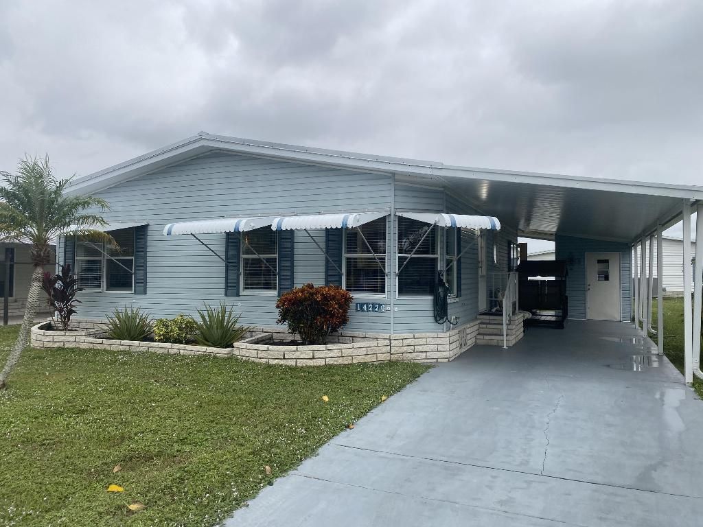 Photo of 14220 Isla Flores Avenue, Fort Pierce, FL 34951 (MLS # R10936333)