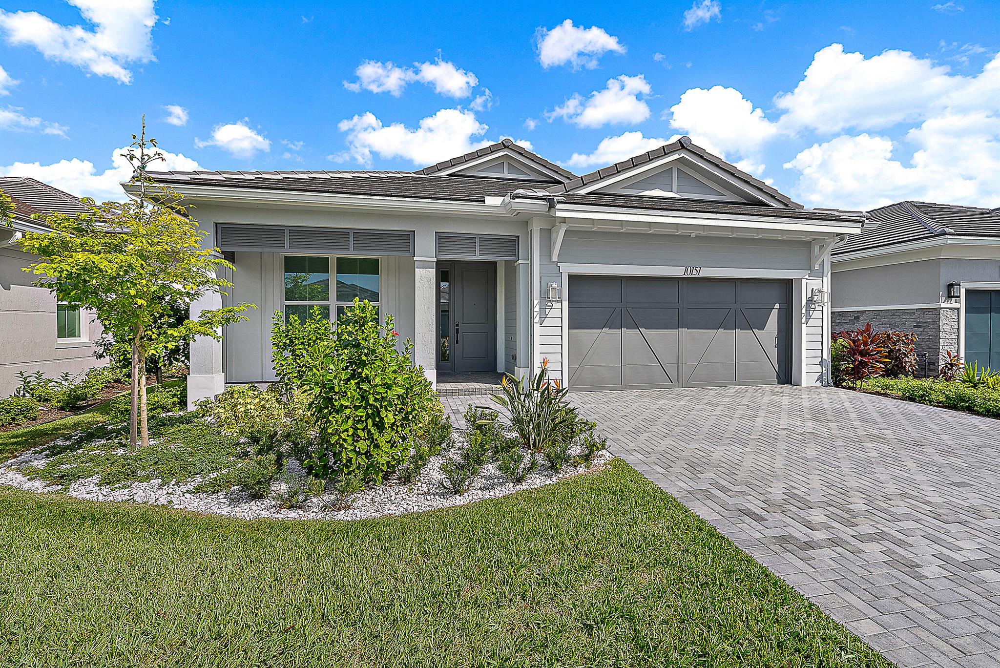 This beautifully designed Samantha Coastal is just steps from the Pearl Clubhouse, Regency's premier amenity center. A welcoming covered entry and tray-ceiling foyer open to the spacious great room and dining area, all with views of the covered lanai. The chef's kitchen features a large center island, abundant counter and cabinet space, and a generous pantry. The primary suite offers a tray ceiling, an oversized walk-in closet, and a spa-like bath with dualvanities, soaking tub, glass-enclosed shower with seat, and private water closet. A secondary bedroom with walk-in closet and full bath, a bright office off the foyer, and a centrally located laundry add to the thoughtful layout.