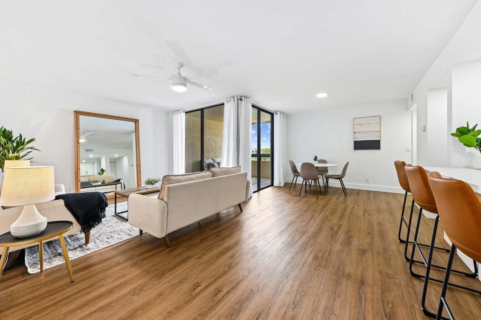 This completely remodeled 2 Bed, 2 Bath unit boasts an open, large gourmet Kitchen with quartz countertops, SS appliances, and extra cabinet space. The condo features modern vinyl flooring throughout and offers stunning views from the split bedrooms overlooking the lake and tennis courts.The spacious Master Bedroom includes a meticulously remodeled Bathroom and a large Walk-in Closet. Enjoy the convenience of a separate laundry room with an in-unit Washer and Dryer. The community offers a Secured Lobby, Pool & Spa. Easy access to I-95, walking distance to Target, Whole Foods, Home Depot & Burger Fi. The beach is less than 2 miles away! Top-notch location and amenities!