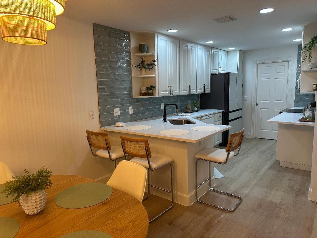 Photo of 3032 W Community Drive, Jupiter, FL 33458 (MLS # B26002231)