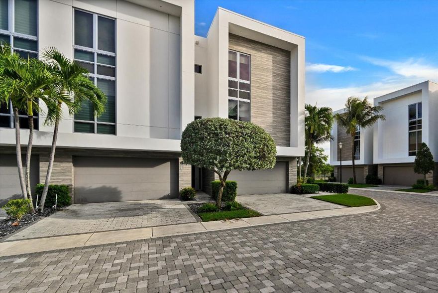 Experience contemporary luxury in a prime location.  This meticulously kept 3 bedroom, 3.5 bathroom corner unit townhouse is situated in the gated community of Moderne. This unit features a private elevator, turfed backyard and a two car garage.  The open floor plan which connects the kitchen, dining and living areas, is perfect for those who love to entertain. This smart home also features impact glass with full lutron shades and security cameras.