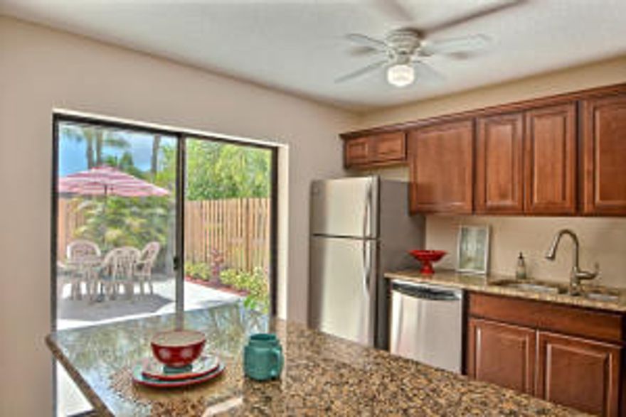 NEWLY REMODELED 2 bedroom, 2.5 bath Stuart townhome. Featuring NEW Flooring throughout, NEWLY updated Kitchen, Stainless steel appliances, NEW granite countertops, NEW vanities in baths, NEW dual sinks, NEW tile in stand up shower, NEW lighting, NEW mirrors, Spacious living room, Private fenced in patio, NEW landscaping, Freshly painted interior and patio floor!