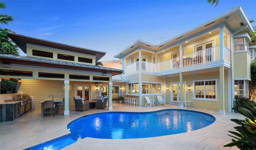 Rebuilt Enlarged Home circa 2008 | Impact Glass | Natural Gas | 2018 Kohler 48KW Entire Home Generator | 2018 Hague Water System | Metal Roof circa 2008 | Zoysia Grass & Artificial Turf | 2-Car Garage | Recent Seawall & Dock Work | Commercial Icemaker. Yachtsmen: 105 Ft Deepwater | No Fixed Bridges & Wide Turning Basin | 50 Amp Service | 25K Boat Lift. Outdoors: Lanai & Full-Service Kitchen | Saltwater Pool & Waterfalls. Living: Salt-Water Aquarium | Hardwood Floors | Built-In Media. Primary BR: Ground Level | 2 Walk-In Closets | Bath has Central Tub, Two Wash Areas. Kitchen & Family Rm: 10' Ceilings & Hardwood Floors | Wolf Gas Range & Subzero Frige | Quartz Tops | Subzero Wine Cooler with Cooling Drawers. Upper Level: Wrap Porch & Living Rm w 9.5' ceilings + 2 Bedrooms, Office, Laundry.