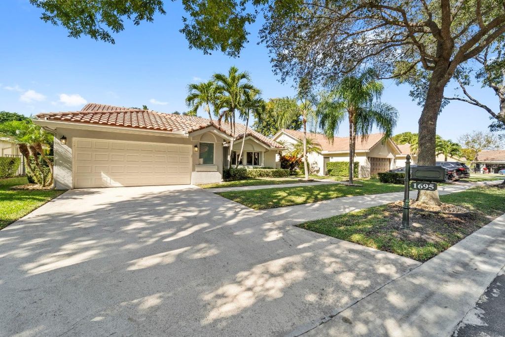 Photo of 1695 Lakeshore Circle, Weston, FL 33326 (MLS # F10545425)