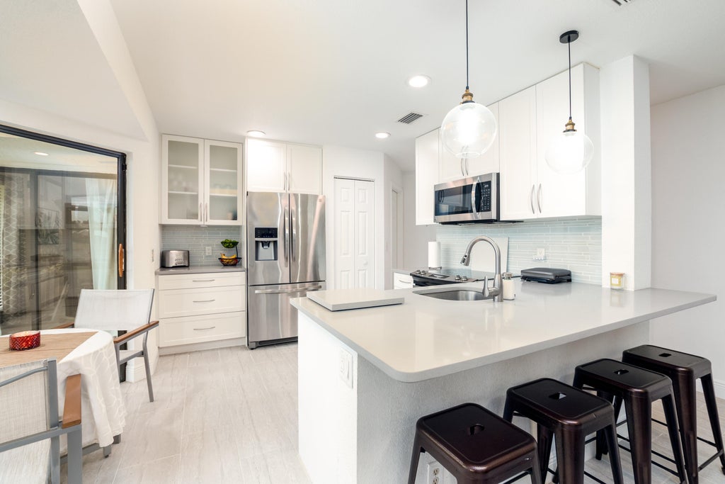 Photo of 3 Lexington Lane E #A, Palm Beach Gardens, FL 33418 (MLS # B26047802)